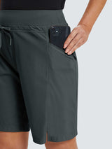 Women's dark gray quick-dry hiking Bermuda shorts with zippered pocket holding a smartphone. #color_Dark Gray