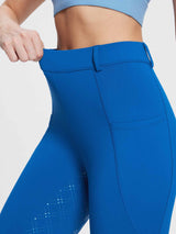 Bright blue women's fleece riding breeches with high-rise waist, pocket, and diamond silicone grip on leg. #color_Quartz Blue