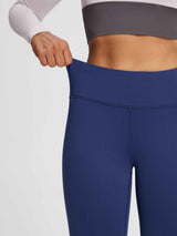 Dark blue thermal fleece yoga leggings with high waistband stretched for elasticity. #color_Black/Blue
