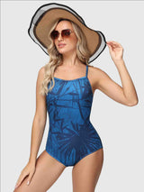 Women's printed one-piece swimsuit in blue with navy tropical leaf design. #color_Blue