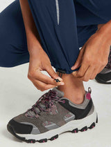 Navy blue Laureate hiking pants with adjustable ankle cinch and reflective stripe. #color_Navy Blue