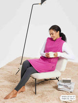Pink sleeveless fleece thermal dress with quarter-zip, styled with white shirt and leggings.