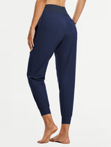 Women's navy tall high-waisted quick-dry hiking joggers with elastic cuffs.