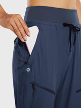 Women's navy tall quick-dry hiking joggers with phone in zippered pocket. #color_Navy Blue