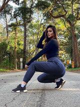 Women's navy tall high-waisted quick-dry hiking joggers on model outdoors. #color_Navy Blue