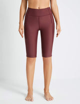 Woman wearing Zinfandel Flyleaf UPF50+ high-rise swim shorts with two side pockets and built-in liner.