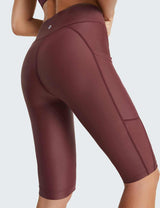 Close-up view of burgundy Flyleaf UPF50+ high-rise swim shorts with pockets on the side.