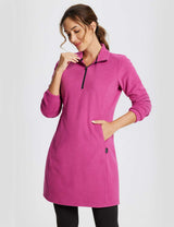 Woman wearing a long-sleeve quarter zip thermal tunic dress in Violet Rose, showing the kangaroo pocket. #color_Violet Rose