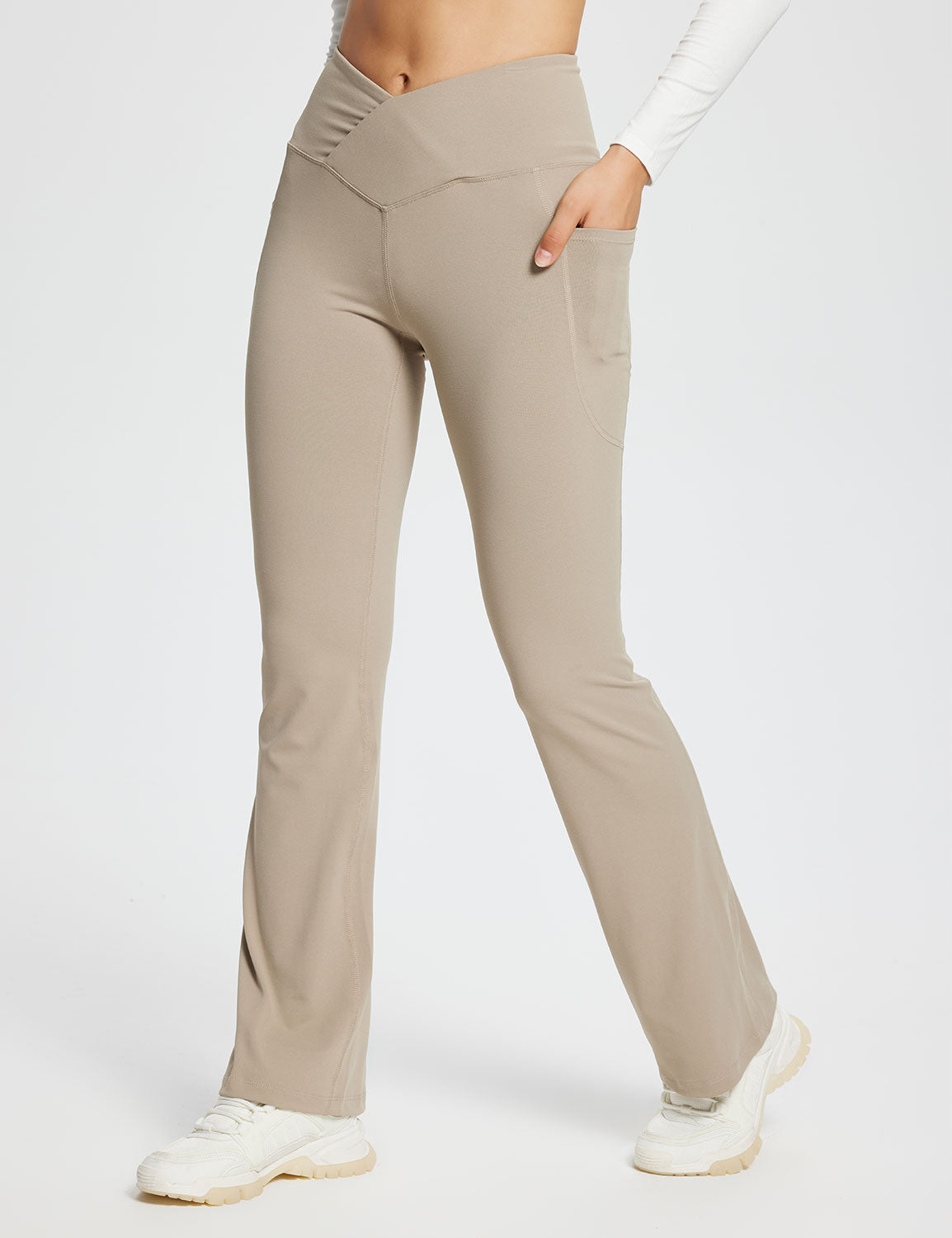 Laureate women's 29" beige crossover high-waisted flare yoga pants with pockets. #color_Khaki
