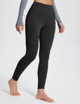 Black high-rise thermal leggings with side pockets, perfect for yoga and winter activities.