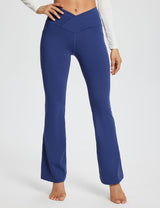 Laureate Women's navy blue 29" crossover high-waisted flare yoga pants with side pockets. #color_Navy Blue