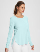 Light blue UPF 50+ long sleeve shirt with thumb loops and side slits on a woman #color_Spa Retreat
