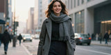 confident woman wearing baleaf flyleaf tapered trousers walking in winter city street