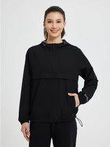 Women's black outdoor packable 1/4 zip windbreaker jacket with hood. #color_Black