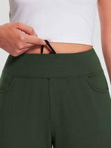 Women's green fleece-lined jogger pants with high waist and pockets. Hand adjusts inner drawstring. #color_Army Green