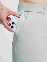 Baleaf UPF 50+ 5-pocket golf pants with zippered pocket holding phone. #color_Light Gray