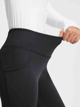 Black thermal fleece high-waist yoga leggings with deep pockets, showing stretch waistband. #color_Black