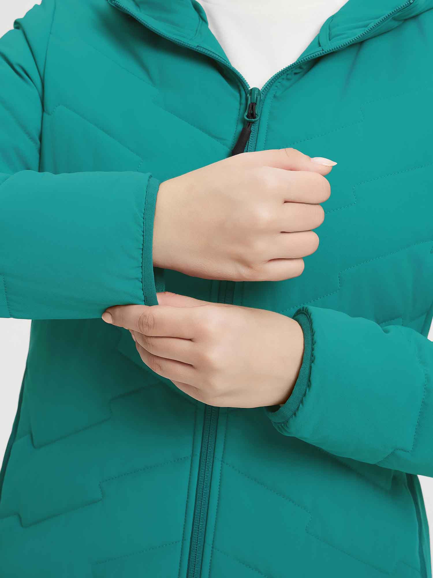 Women's teal mid-length puffer jacket with quilted pattern and zipper #Color_Green