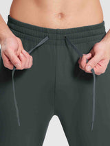 Men's dark grey reflective jogger pants with adjustable drawstring waist.