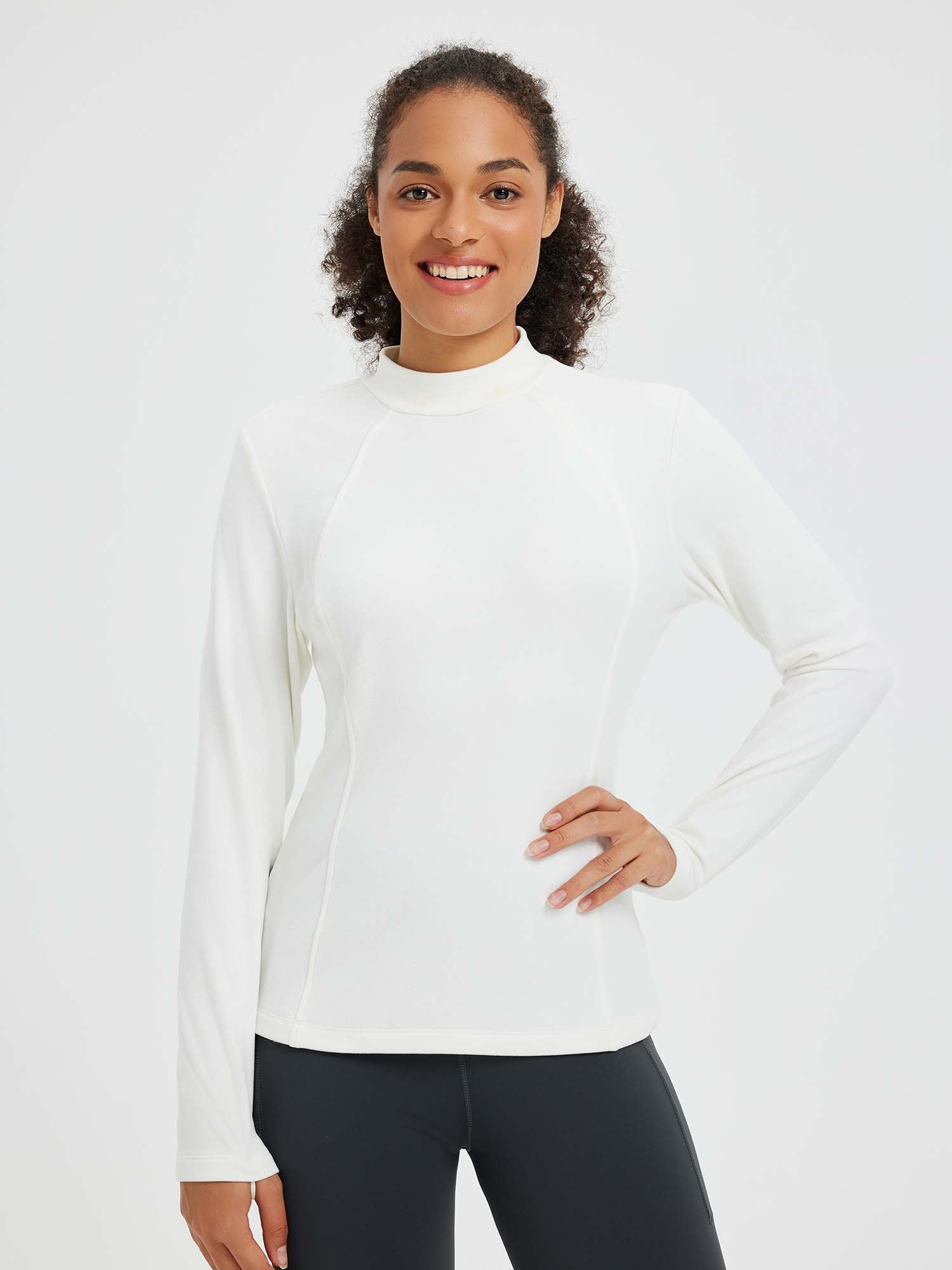 White fleece running half-turtleneck t-shirt with mock neck and flattering seams.