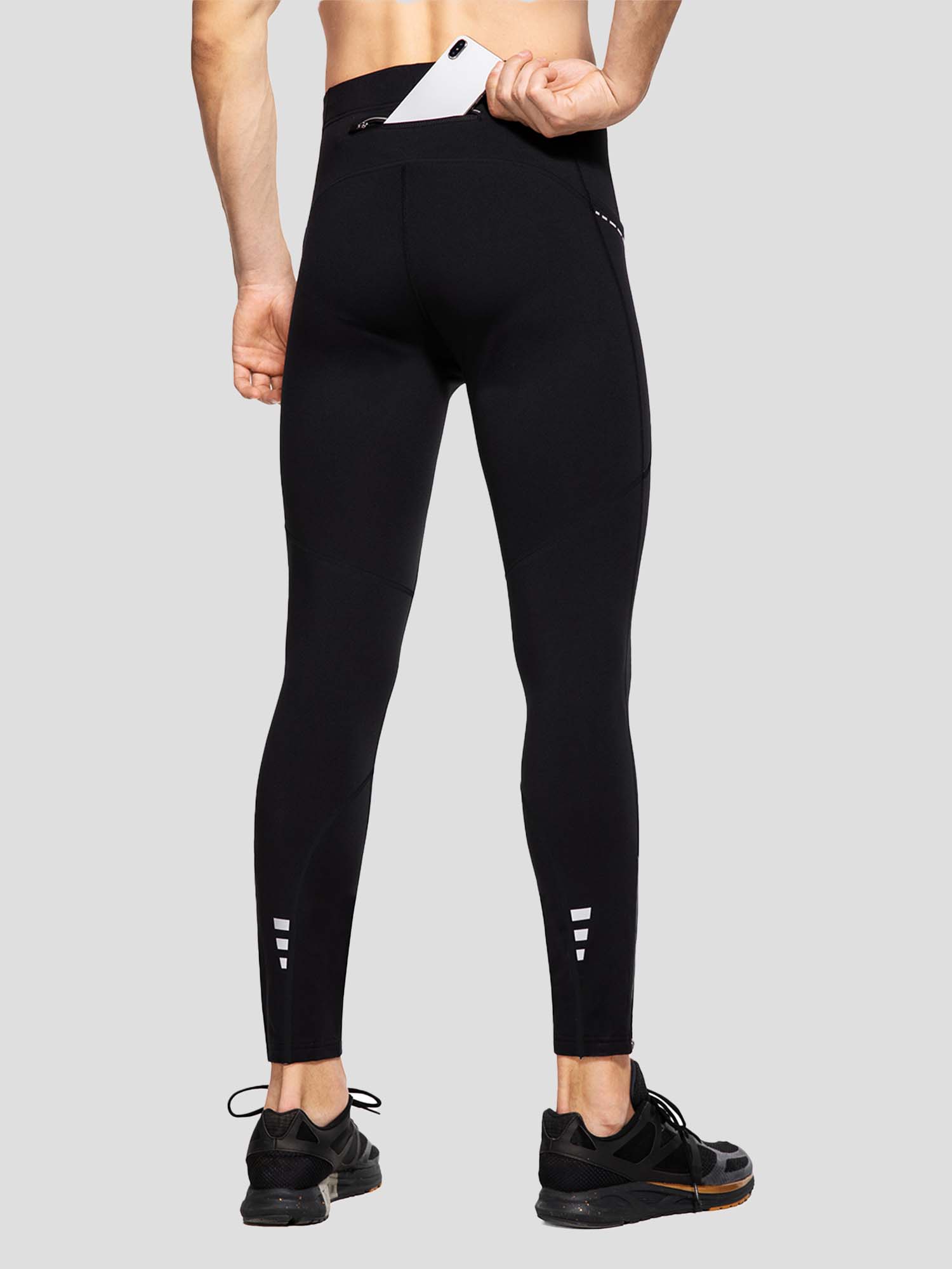 Men's winter fleece-lined cycling tights with phone pocket and reflective ankles. #color_Black