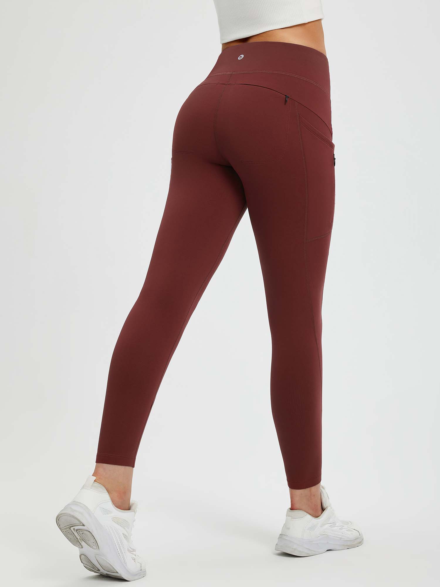 25" fleece-lined yoga leggings in burgundy with high waist and zip pockets. #color_Wine Red