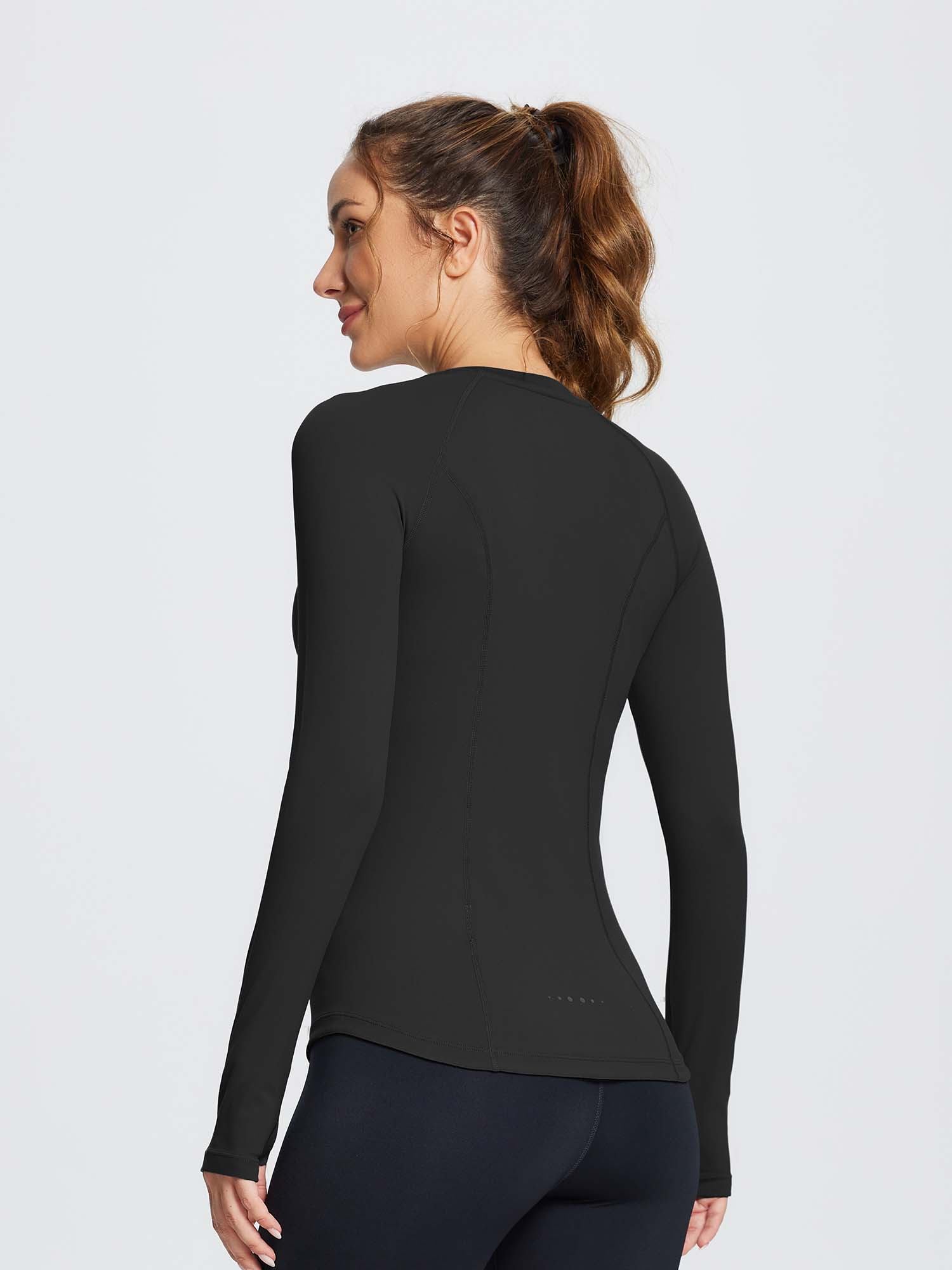 Black women's compression long-sleeve running top with contoured seams #color_Black