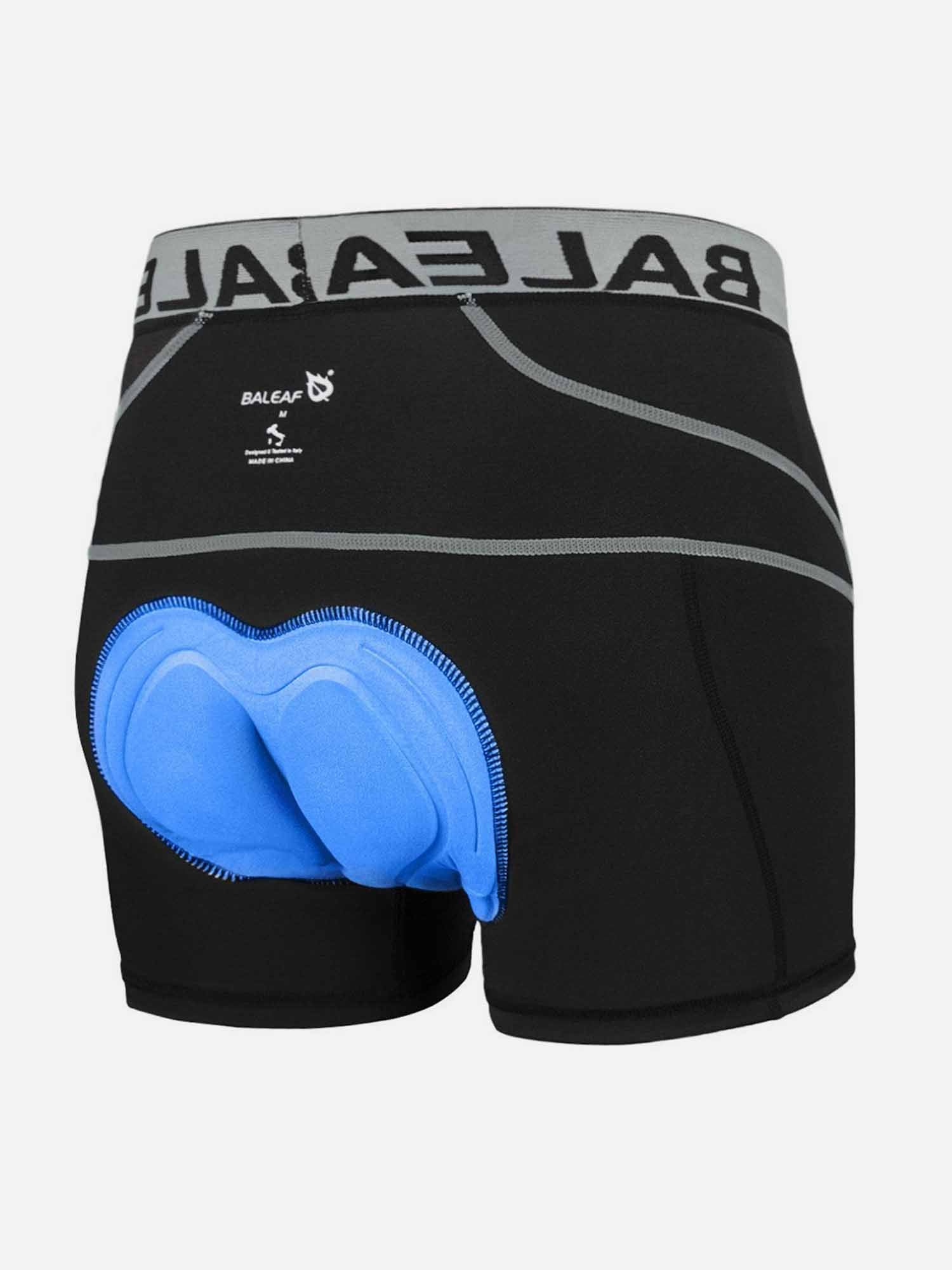 Men's black cycling shorts with blue 3D padded chamois and elastic waistband. #color_Gray