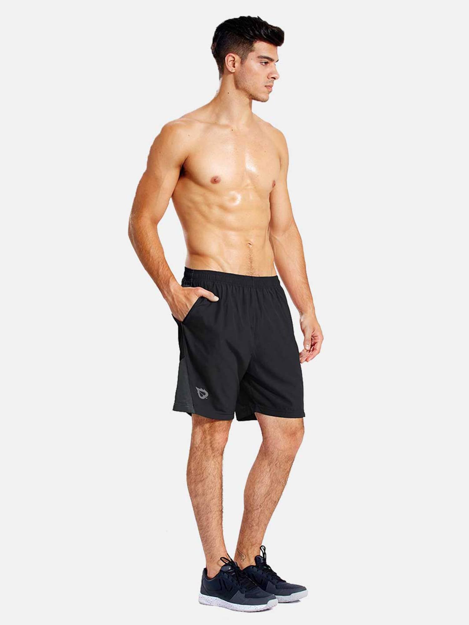 Men's black 7-inch inseam running shorts with liner, side pockets, and subtle logo. #color_Black