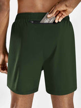 Men's dark green 5" running shorts with a rear zip pocket showing a card being inserted. #color_Army Green