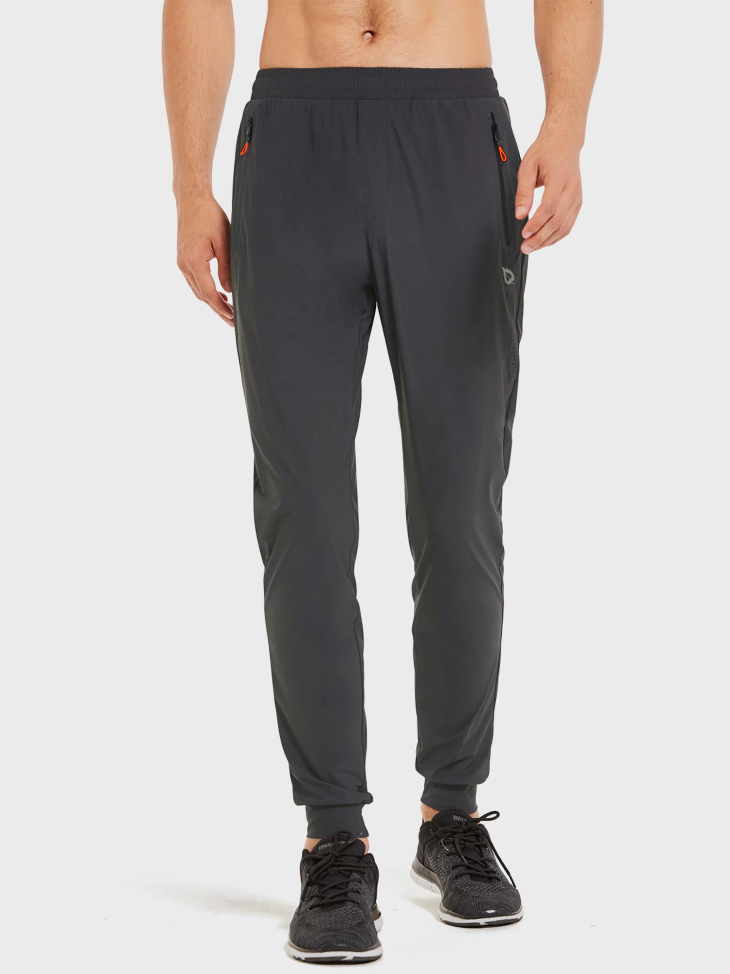 Men's dark grey running joggers with zip pockets, side mesh panels, and tapered cuffs. #color_Dark Gray