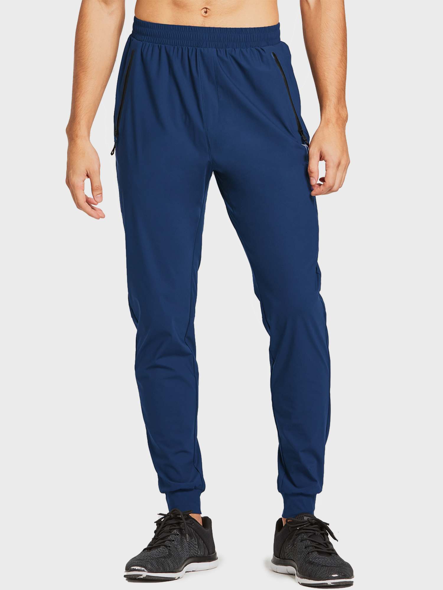 Men's dark blue lightweight jogger running pants with zippered pockets and tapered cuffs. #color_Navy Blue
