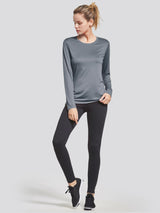 Grey long-sleeve quick-dry women's running shirt with black leggings and sneakers #color_Gray