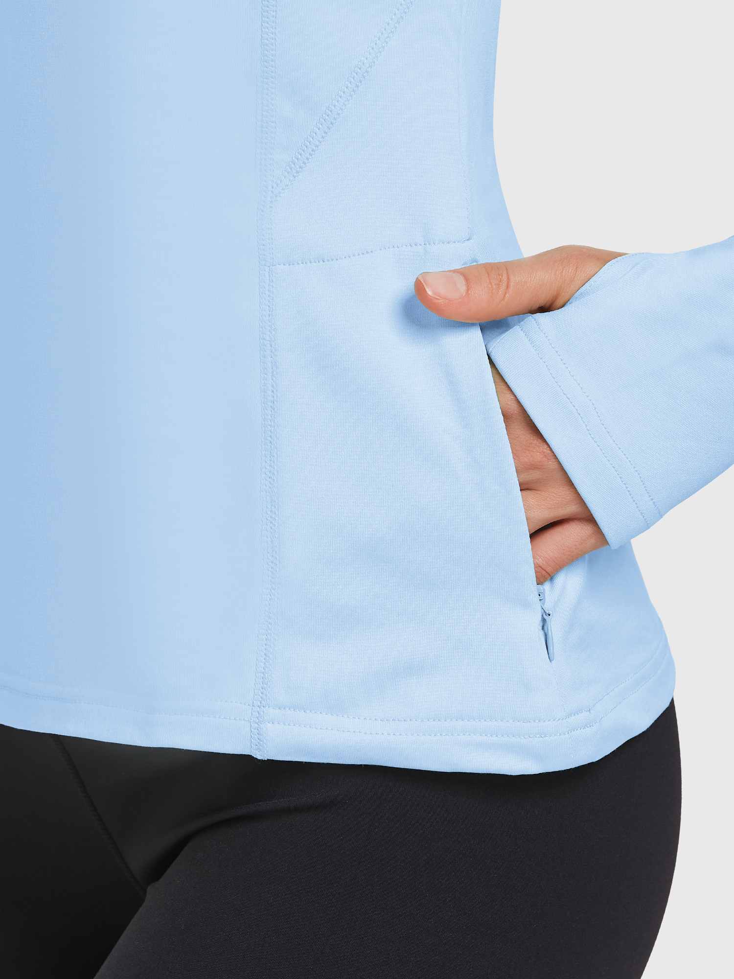 Light blue fleece pullover with zip pocket and thumbhole cuff. #color_Light Blue