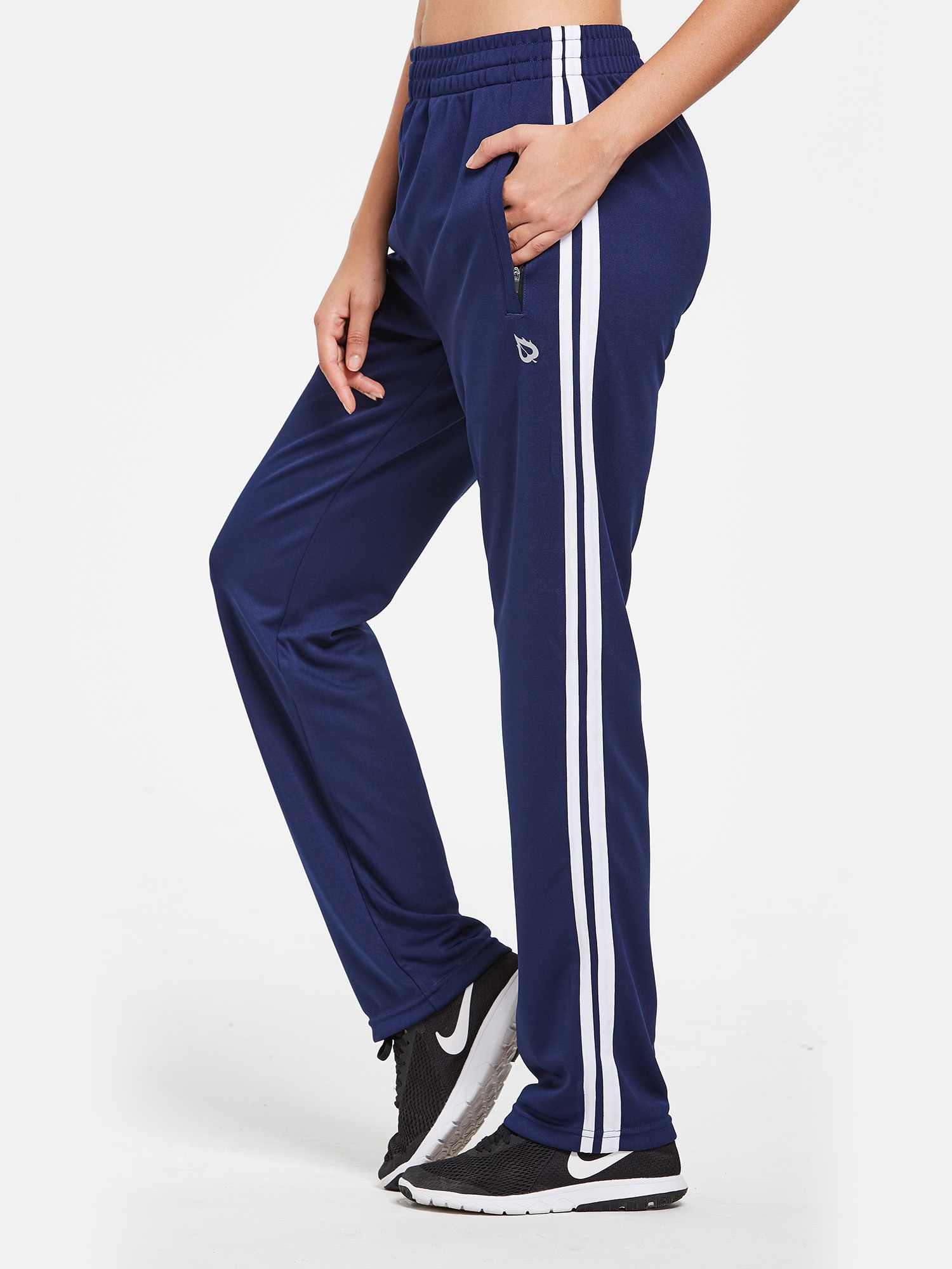 Knit Straight-Leg Running Pants in navy with white side stripes and zip pockets.
