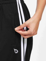 Knit straight-leg running pants in black with white side stripes and zippered pocket. #color_Black/White