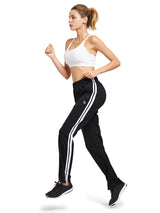 Black knit straight-leg running pants with white side stripes, woman running. #color_Black/White