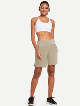 Women's khaki 7" running shorts with liner, lightweight A-line fit, high-rise waistband. #color_Khaki