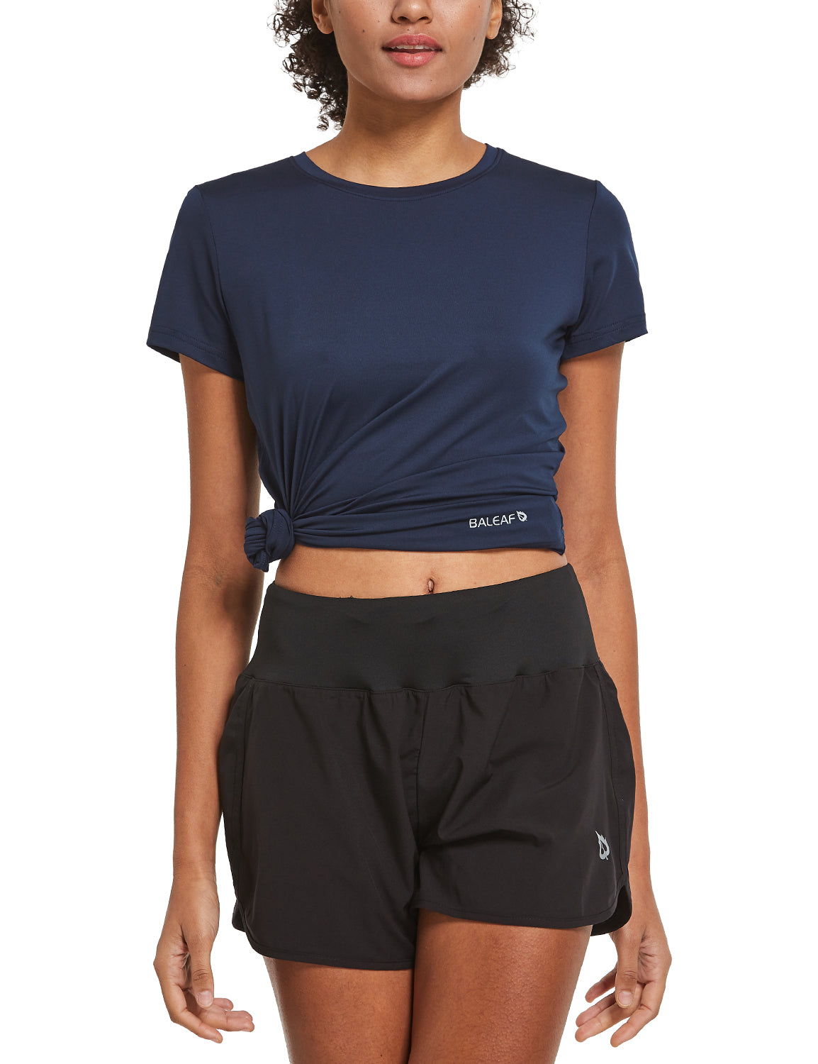 Baleaf women's navy t-shirt tied at waist with black running shorts for Everyday Active Set.