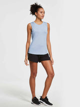 Women's light blue sleeveless workout tank, loose fit, hip-length, with black shorts. #color_Kentucky Blue