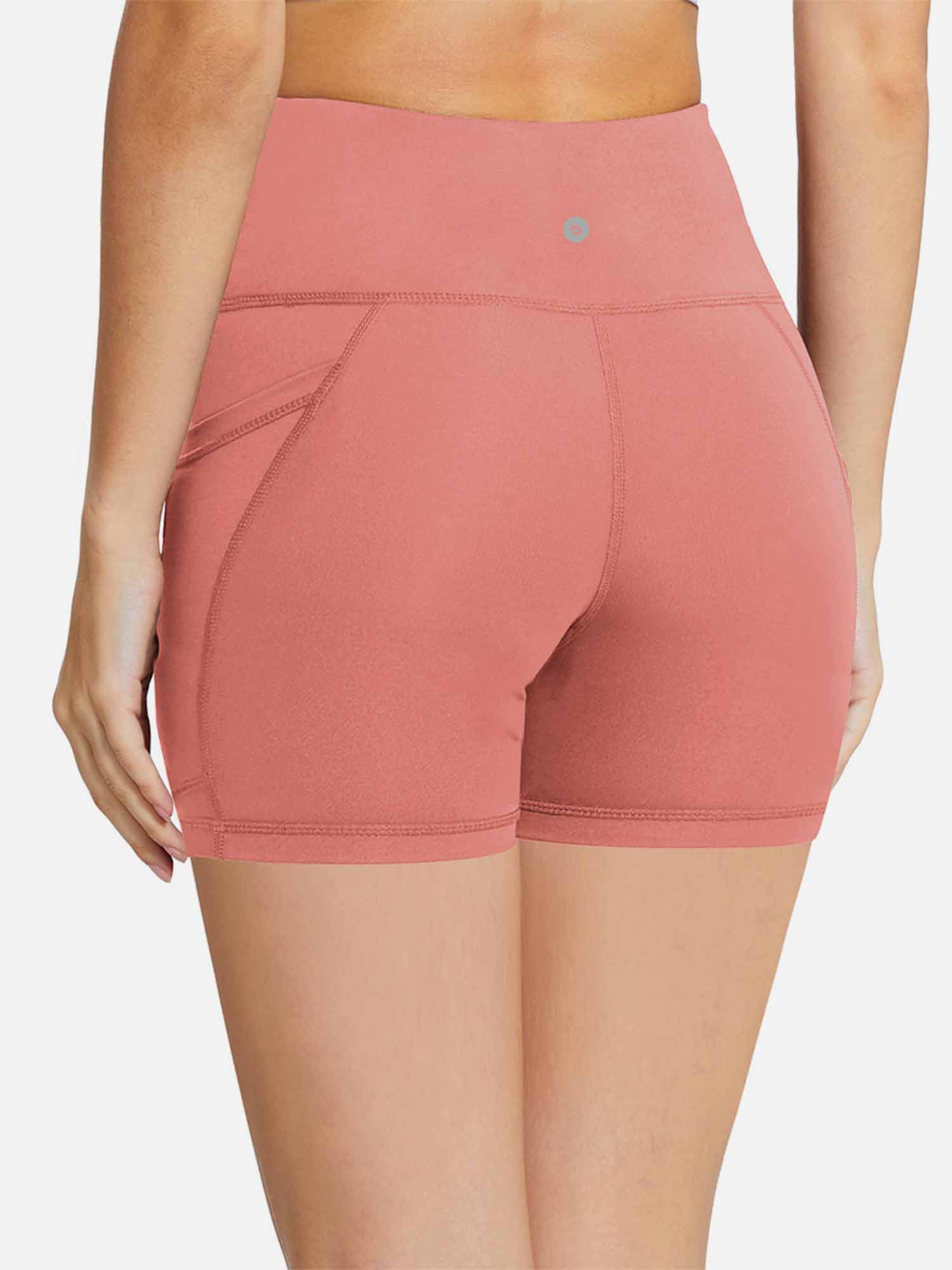 Women's coral 5-inch high-waisted compression biker shorts with tummy control and pockets. #color_Coral Red