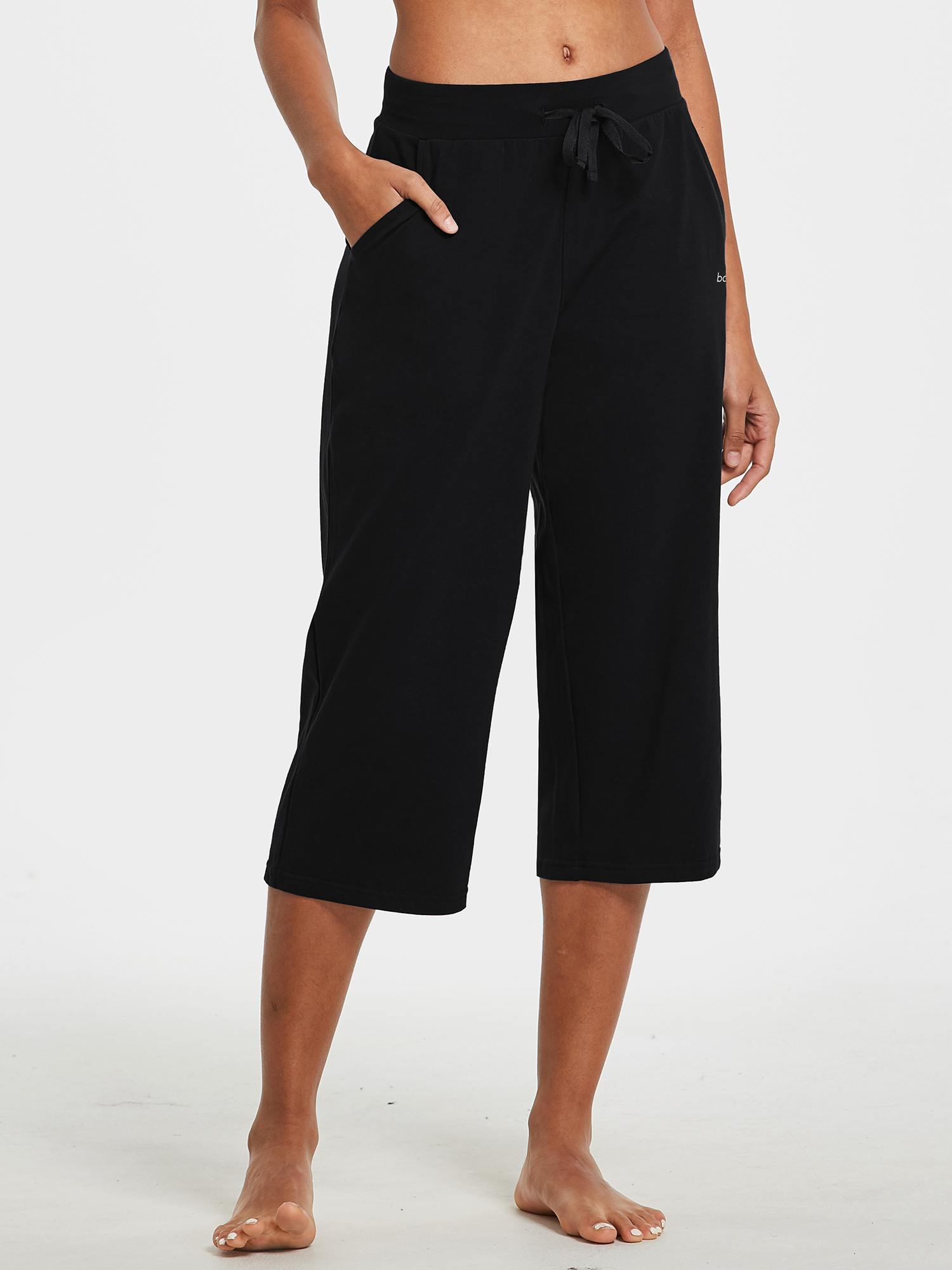 Black women's wide-leg cotton capri pants with drawstring waist and side pockets. #color_Black