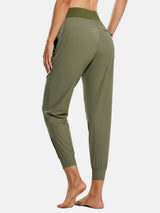 Women's olive green high-waisted quick-dry hiking joggers with cuffed ankles and zip pocket. #color_Light Green