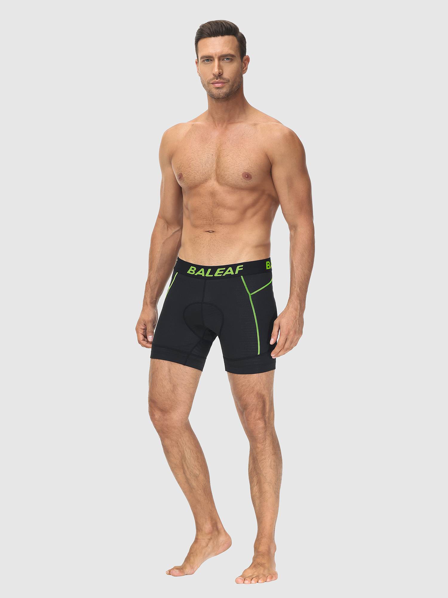 Men's black 4D cycling underwear with neon green accent stitching and logo. #color_Fluorescent Green