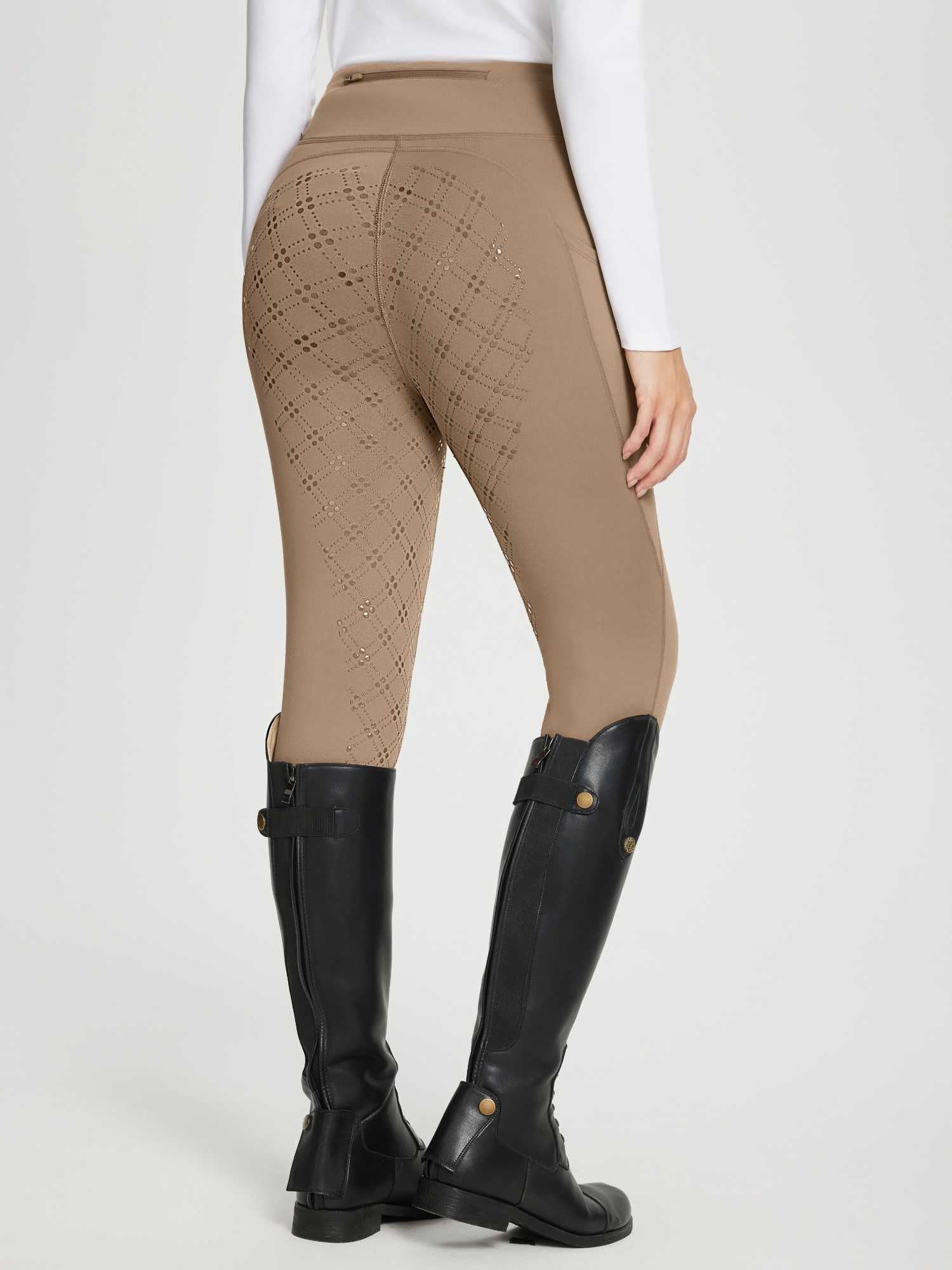 Women's tan full seat equestrian breeches with diamond laser-cut pattern and back zip pocket. #color_Brown