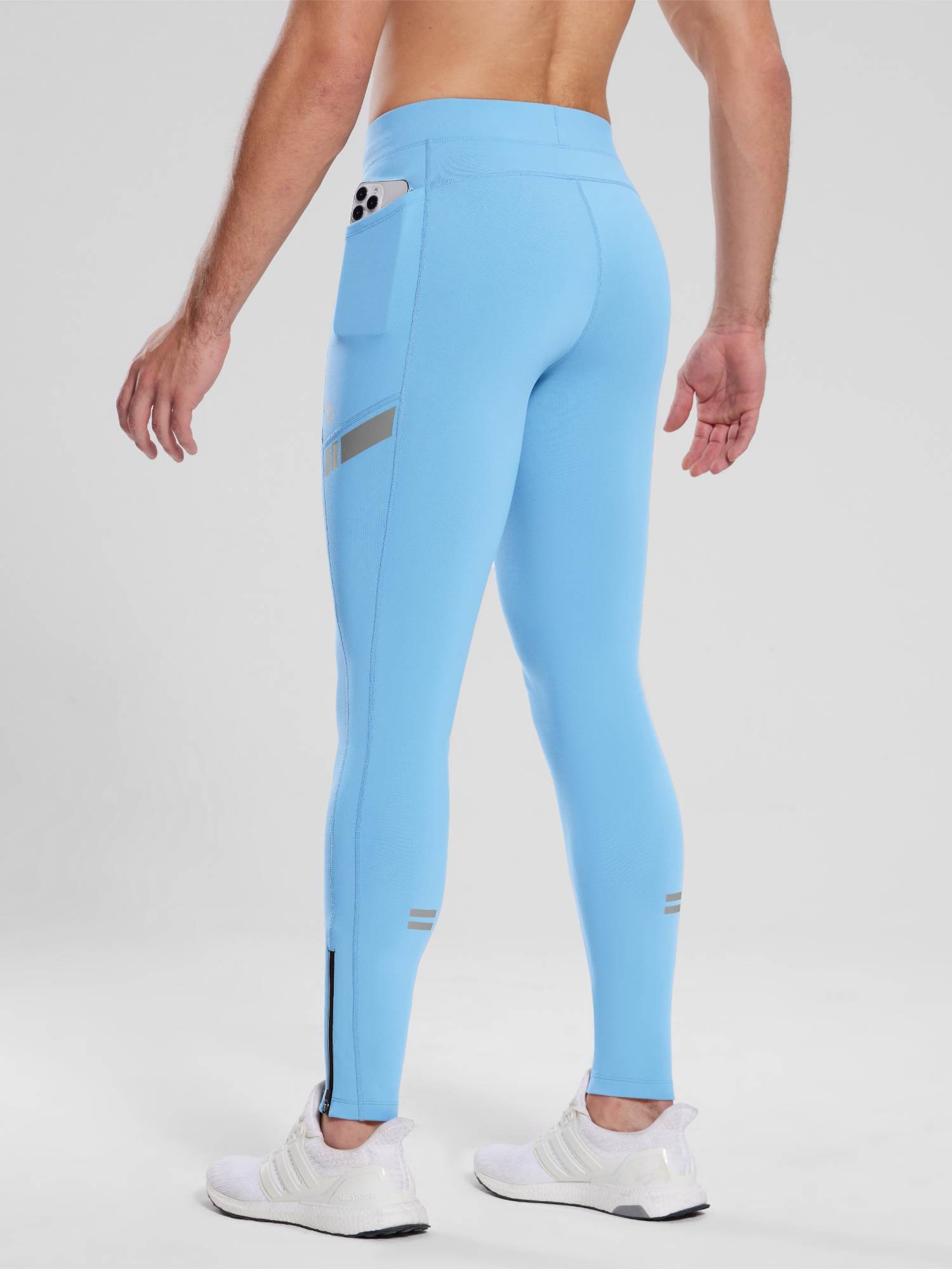 Men's light blue fleece-lined cycling tights with side phone pocket and reflective ankle stripes. #color_Blue