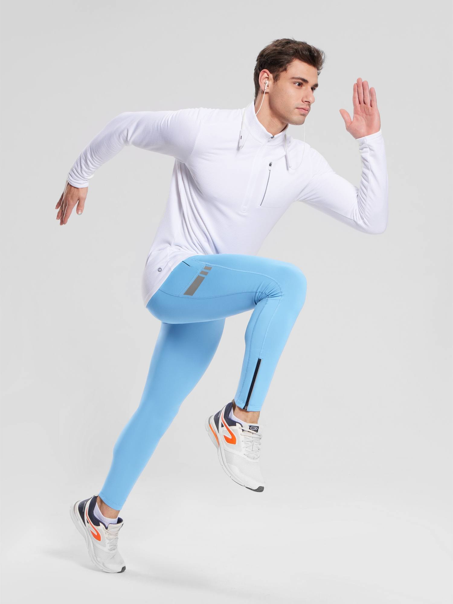 Men's blue fleece-lined cycling tights with reflective stripes and ankle zippers.