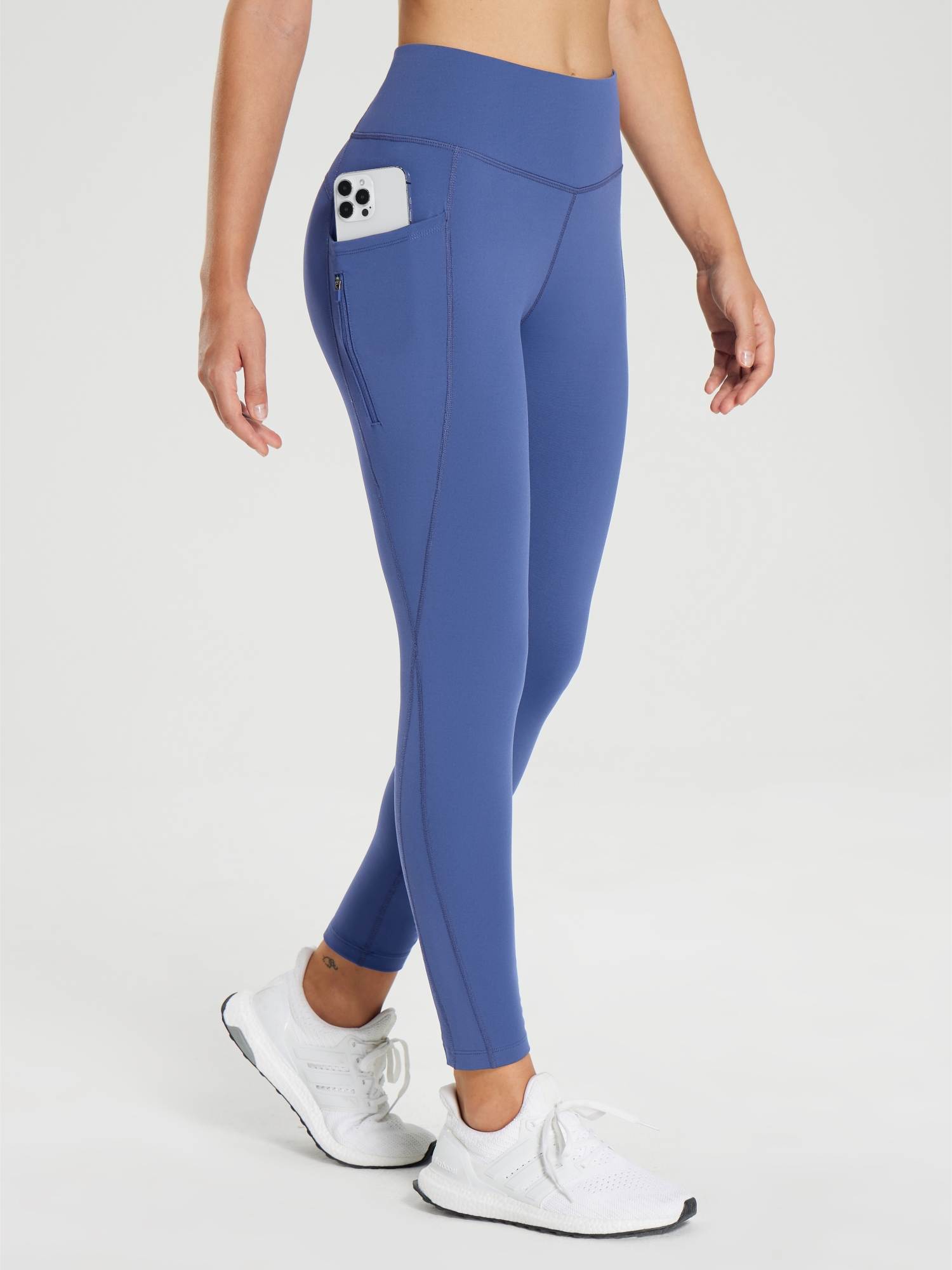 Women's blue fleece-lined cycling leggings featuring phone and zip pockets. #color_Navy Blue