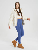 Model wearing blue fleece-lined cycling leggings for cold weather. #color_Navy Blue