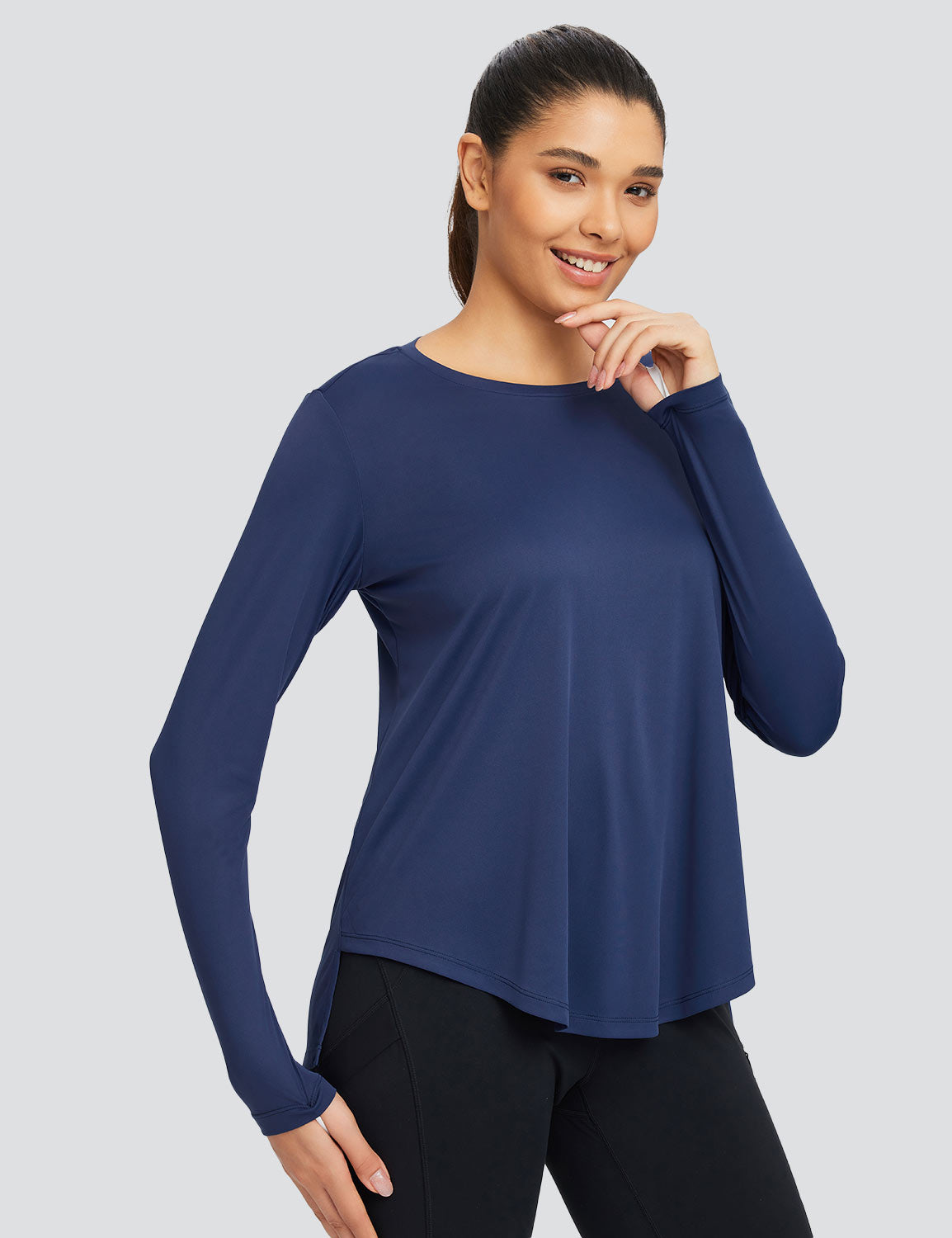 Navy blue loose crew neck long sleeve t-shirt with relaxed fit and hip-length hem.